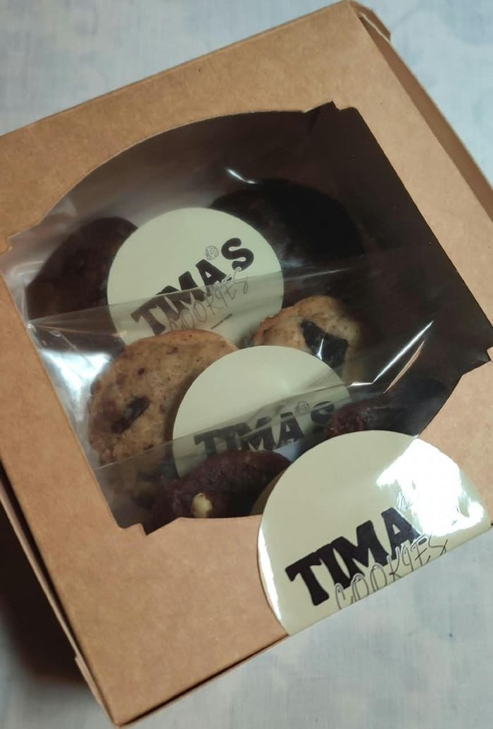 Kraft Tima's box with a round window and stickered cookie bags